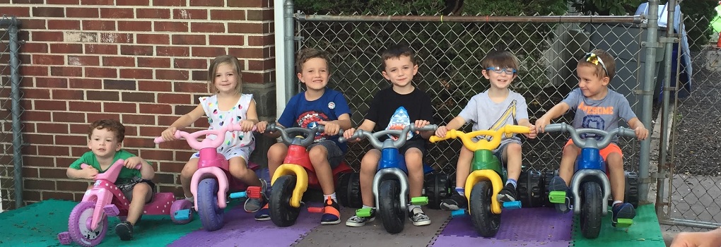 Kids on play bikes
